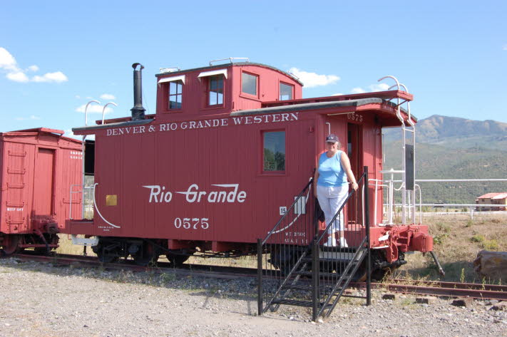 Jill posing on caboose